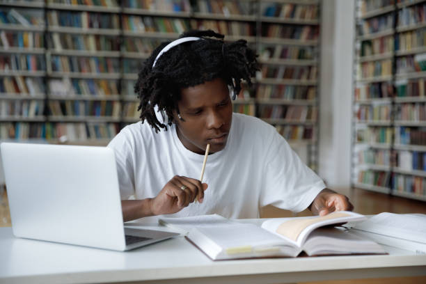 istock Focused African American male student preparing for exam. 1385706226