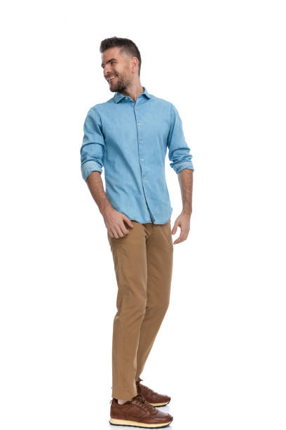 istock happy middle aged man looking behind and smiling 1385708089