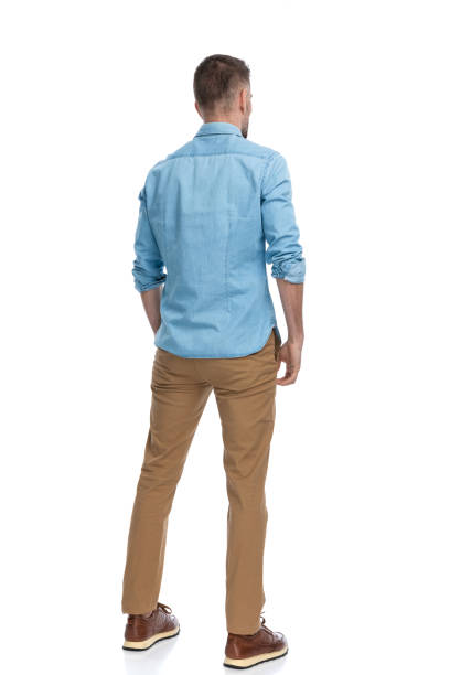 istock man in his forties standing in a back view position 1385708265