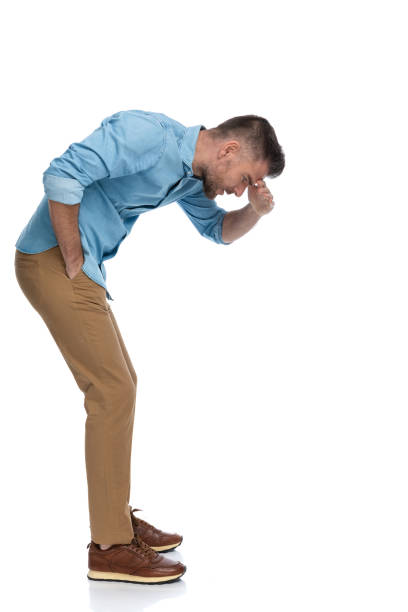 istock sexy unshaved. man with hand to forehead looking down 1385708322