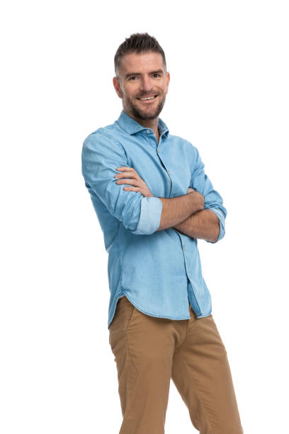 istock enthusiastic grey haired man with arms folded smiling and being happy 1385708420