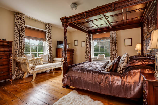 istock Historic Victorian Rectory Bedroom with varved four poster bed 1385709371