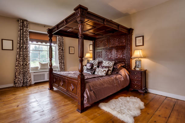 istock victorian rectory bedroom with ornate carved four poster bed 1385709384