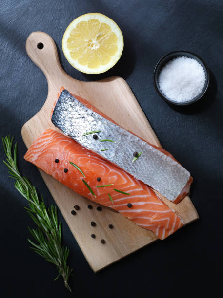 istock Top view of fresh raw salmon with ingredients 1385710095
