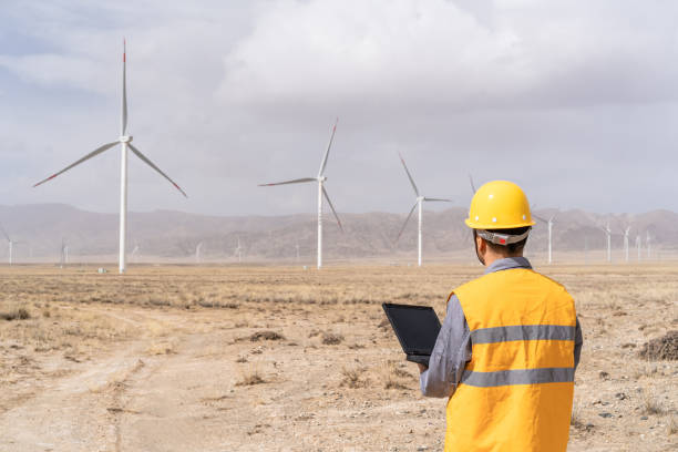 istock Asian male power engineer is working in wind power station 1385711648