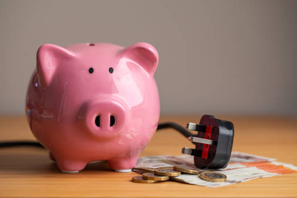Piggy Bank and an electric cable stock photo