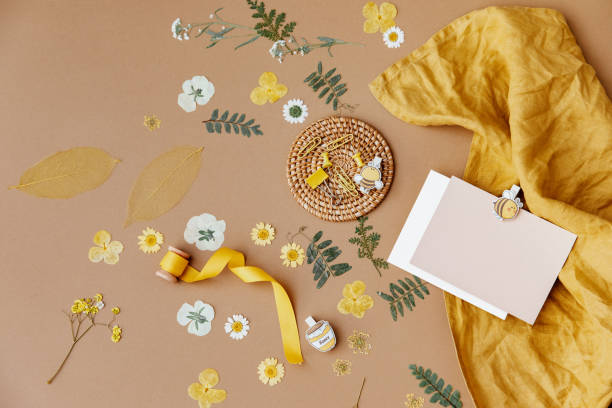 Flat lay dry flowers and blank card on neutral background. Minimal composition. Blogger composition. Modern aesthetic. Neutral earth tones. stock photo