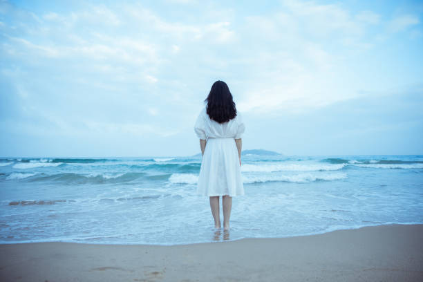 Young women looking at the sea
