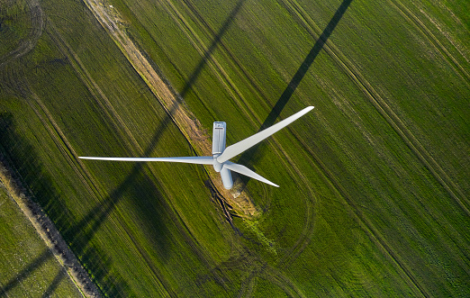 Wind turbines and landscape in Denmark - Europe. Flying above windmills in agricultural landscape