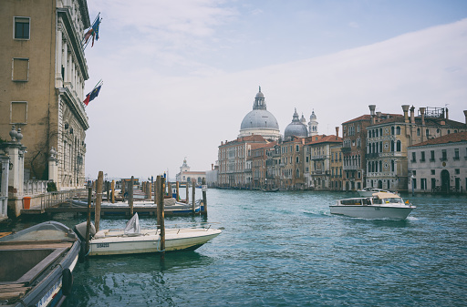 Looking out across the magnificent Grand Canal in Venice, with the majestically-domed Santa Maria della Salute Basilica in the background.