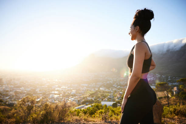 istock Fit woman looking at the scenic view during a break from a run 1385715623
