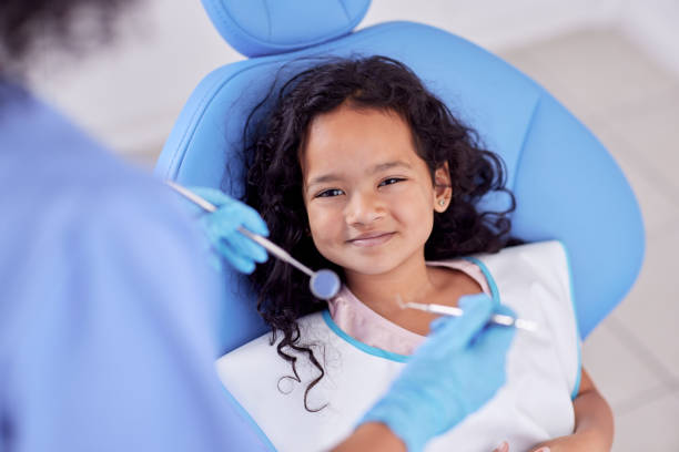 shot of an adorable little girl having dental work done on her teeth - dentist imagens e fotografias de stock