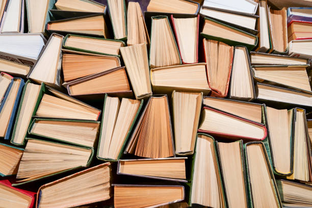 istock Lots of books on the table, spines up. 1385721222