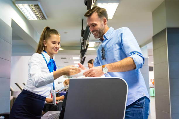 istock Passenger doing check-in for flight at airport 1385722066