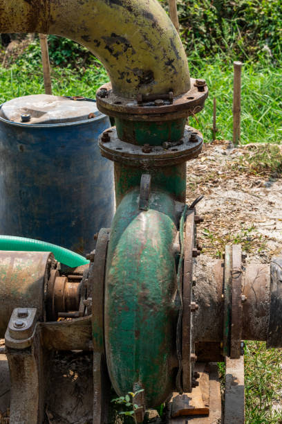istock Old abandoned pump machine close up shot on a sunny day 1385725329