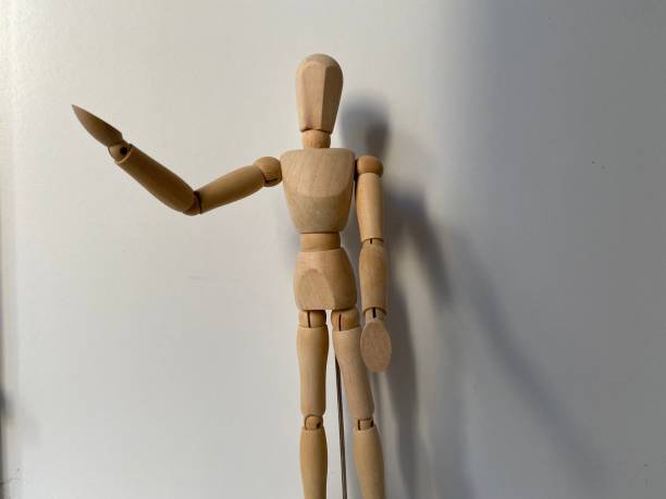 istock wooden mannequin on a white background 1385726065