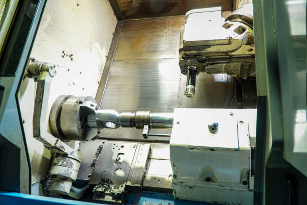 istock CNC lathe. Metal work. Modern metal processing technology. in the industrial plant 1385726375