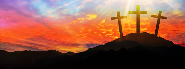 istock Easter background banner panorama religious greeting card Crucifixion and Resurrection. Three crosses of Golgotha by sunset 1385726743