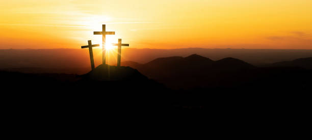 istock Easter background banner panorama religious greeting card Crucifixion and Resurrection. Three crosses of Golgotha by sunset. 1385727795