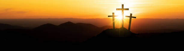 istock Easter background banner panorama religious greeting card Crucifixion and Resurrection. Three crosses of Golgotha by sunset. 1385727805
