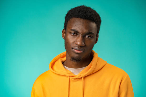 istock Young black anxious man worried nervous fail problem over mint background 1385727968