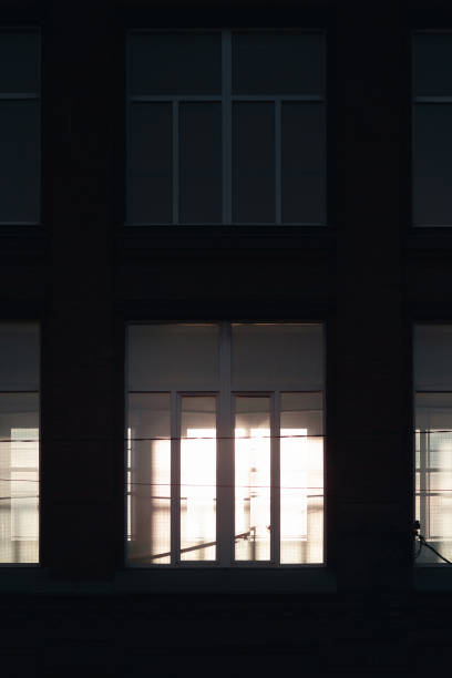 istock A light passing through a window in the dark foreground 1385728916