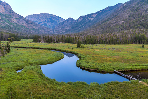 A calm Summer evening view of winding East Inlet Creek at East Meadow. Grand Lake, Rocky Mountain National Park, Colorado, USA.