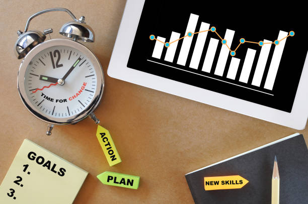 istock Growth graph on computer digital tablet and goals, plan, action and new skills on sticky note on working desk 1385735110