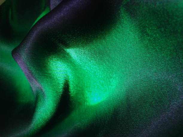 istock Green  silk satin luxury fabric background with copy space  background 1385735741