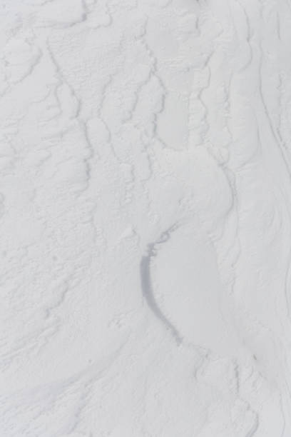 istock ripples in the snow formed by the strong wind from the mountain 1385738093