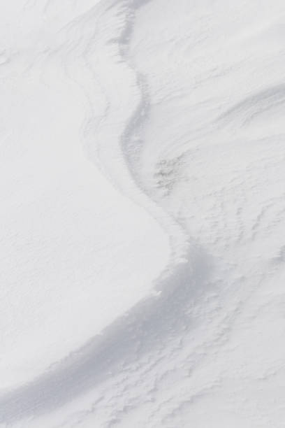 istock ripples in the snow formed by the strong wind from the mountain 1385738129