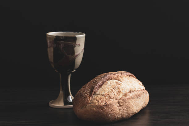 Clay chalice and bread stock photo