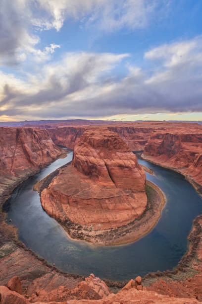 Famous Colorado River Horseshoe Bend During a Dramatic Sunset with Red Cliffs of Glen Canyon National Recreation Area in Page Arizona  USA The breathtakingly beautiful scenery of Colorado River's Horseshoe Bend of Glen Canyon National Recreation Area in Page, AZ. glen canyon stock pictures, royalty-free photos & images