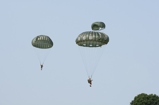 WW2 Parachute Jump Re-enactment \nRAF Fairford, Gloucestershire, England: July 15th 2018\nWorld War II paratrooper drop re-enactment at the 2018 Kent Battle of Britain WW2 World war re-enactment and display