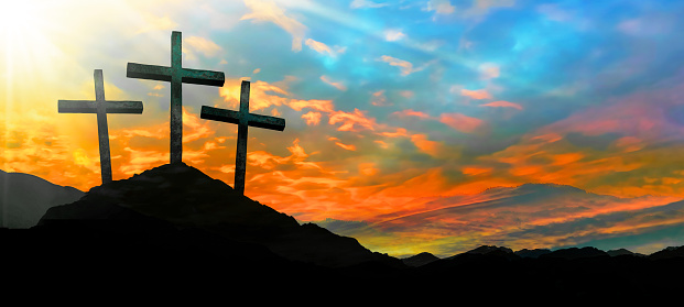 Easter background banner panorama religious greeting card Crucifixion and Resurrection. Three crosses of Golgotha by sunset.