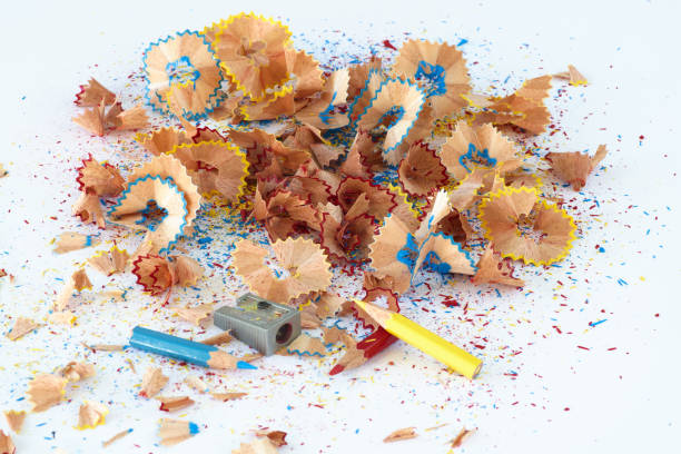 istock Sharp colored pencil shavings placed in a mound on white background 1385744085