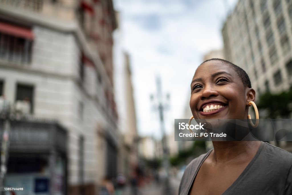 Contemplative mid adult woman in the street 35-39 Years Stock Photo Contemplative mid adult woman in the street 35-39 Years Stock Photo