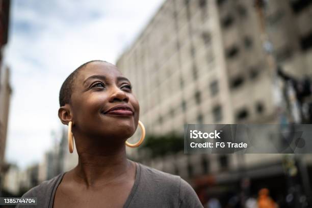 Contemplative Mid Adult Woman In The Street Stock Photo - Download Image Now - Hope - Concept, African-American Ethnicity, Black People