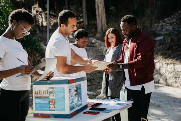 istock Group of young volunteers help the community 1385746507