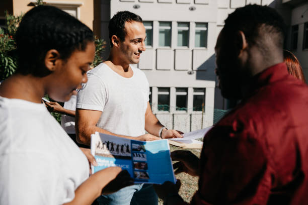 istock Group of young volunteers help the community 1385746652