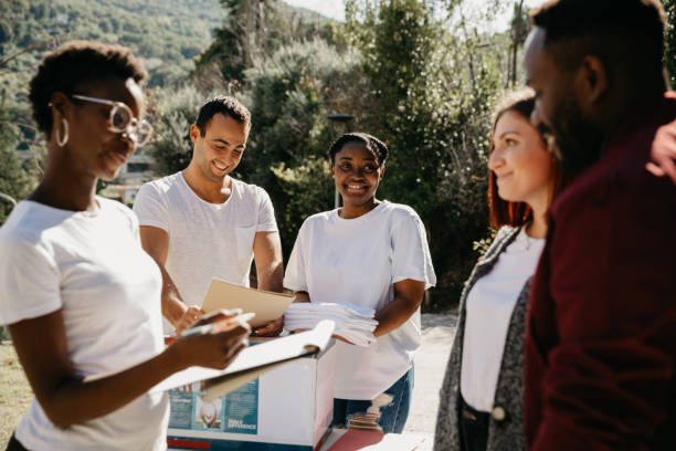 istock Group of young volunteers help the community 1385746764