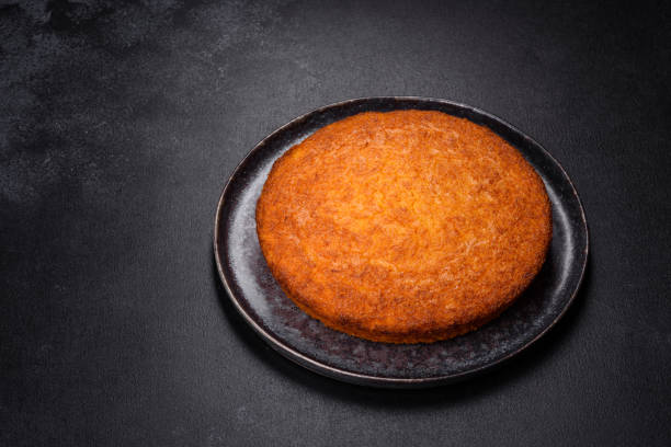 istock Pumpkin pie on marble cutting board. Dark background. Copy space 1385748534
