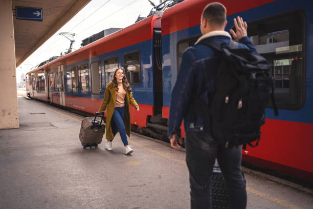 istock Young couple at the train station 1385749214