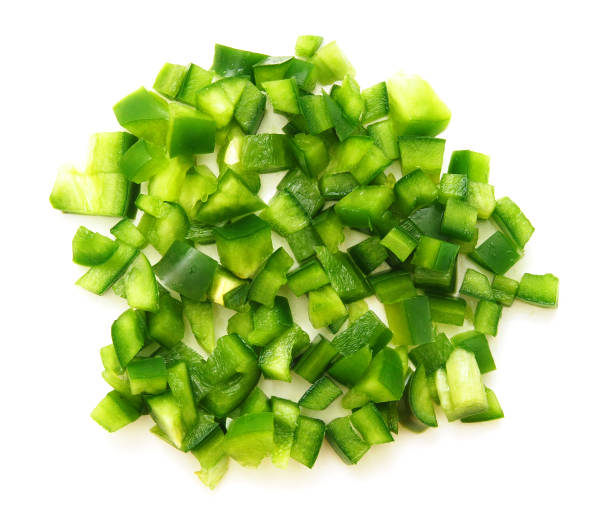 istock sliced green bell pepper in a bowl on white background 1385749947