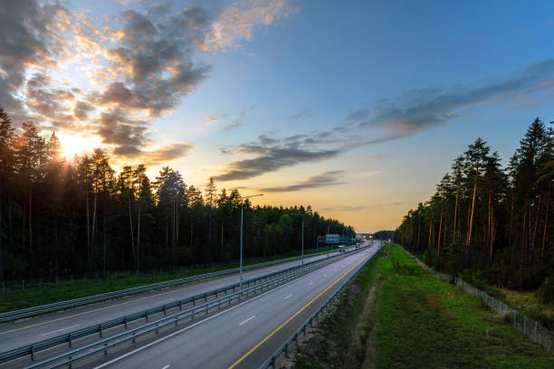 istock Aerial view of a multiple lane highway at sunset 1385755046