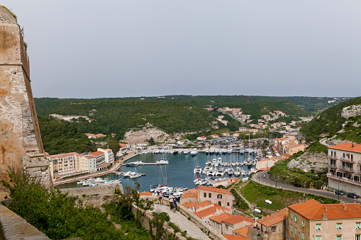 Port and historic center of Banifacho Harbor. Harbor with yachts, limestone rocks and stone fortress.Sights and Landscapes of Corsica Island