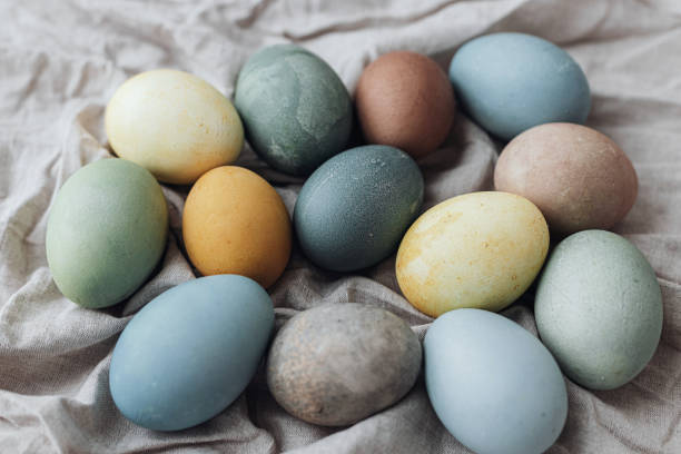 istock Happy Easter! Easter eggs on rustic linen napkin. Stylish natural dyed pastel colorful eggs composition. Rustic still life, top view 1385765614