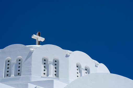 A beautiful white Orthodox Church and an amazing blue sky in Santorini Greece