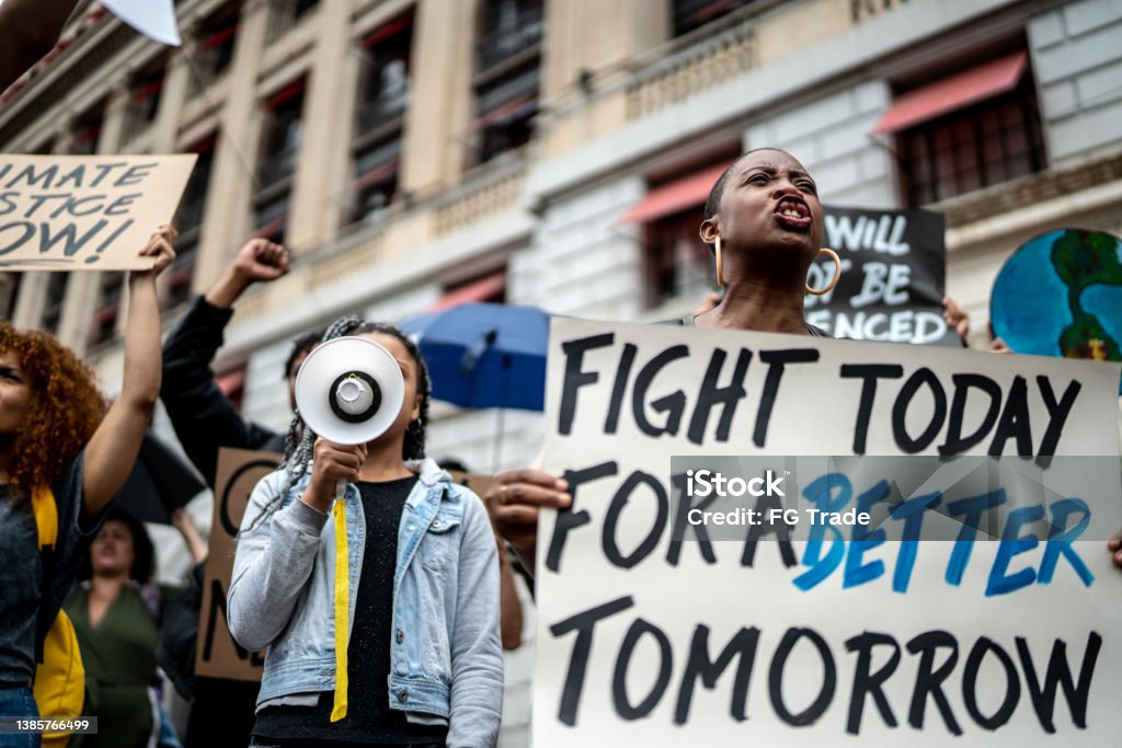 Protests holding signs during on a demonstration Anti-racism Stock Photo