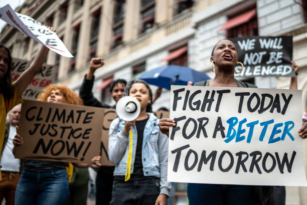 istock Protests holding signs during on a demostration for environmentalism 1385766501